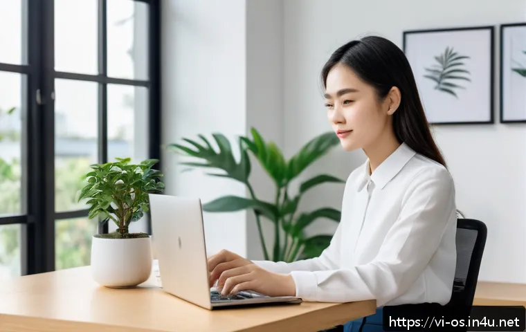윈도우 11에서 앱 호환성 문제 해결 - A modern Vietnamese office setting with a young professional woman sitting at a sleek desk using a W...
